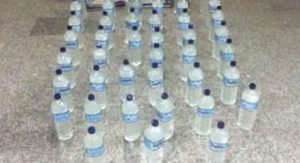 ضبط 3 آسيويين بحوزتهم 80 «بُطل خمر» في الفحيحيل