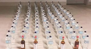 91 زجاجة محلية ومستوردة بحوزة آسيوي سقط في حولي