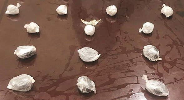 ضبط إيراني يخفي «هيرويين» في أمعائه ويدخل بها الى الكويت